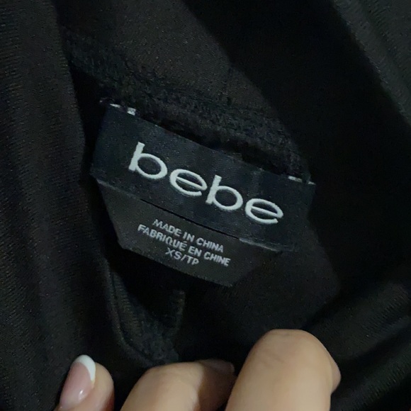 NWOT. Bebe black midi length skirt. Never worn. - Picture 3 of 6